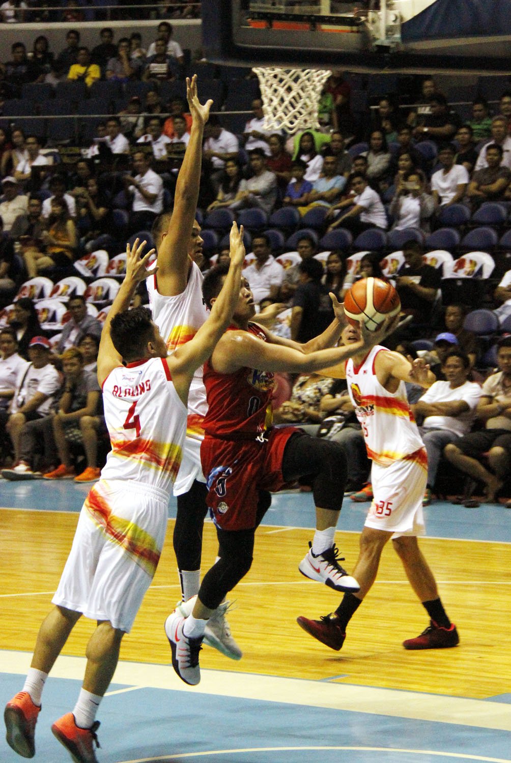 ROS rookie Tolomia tries to score over PHX defenders