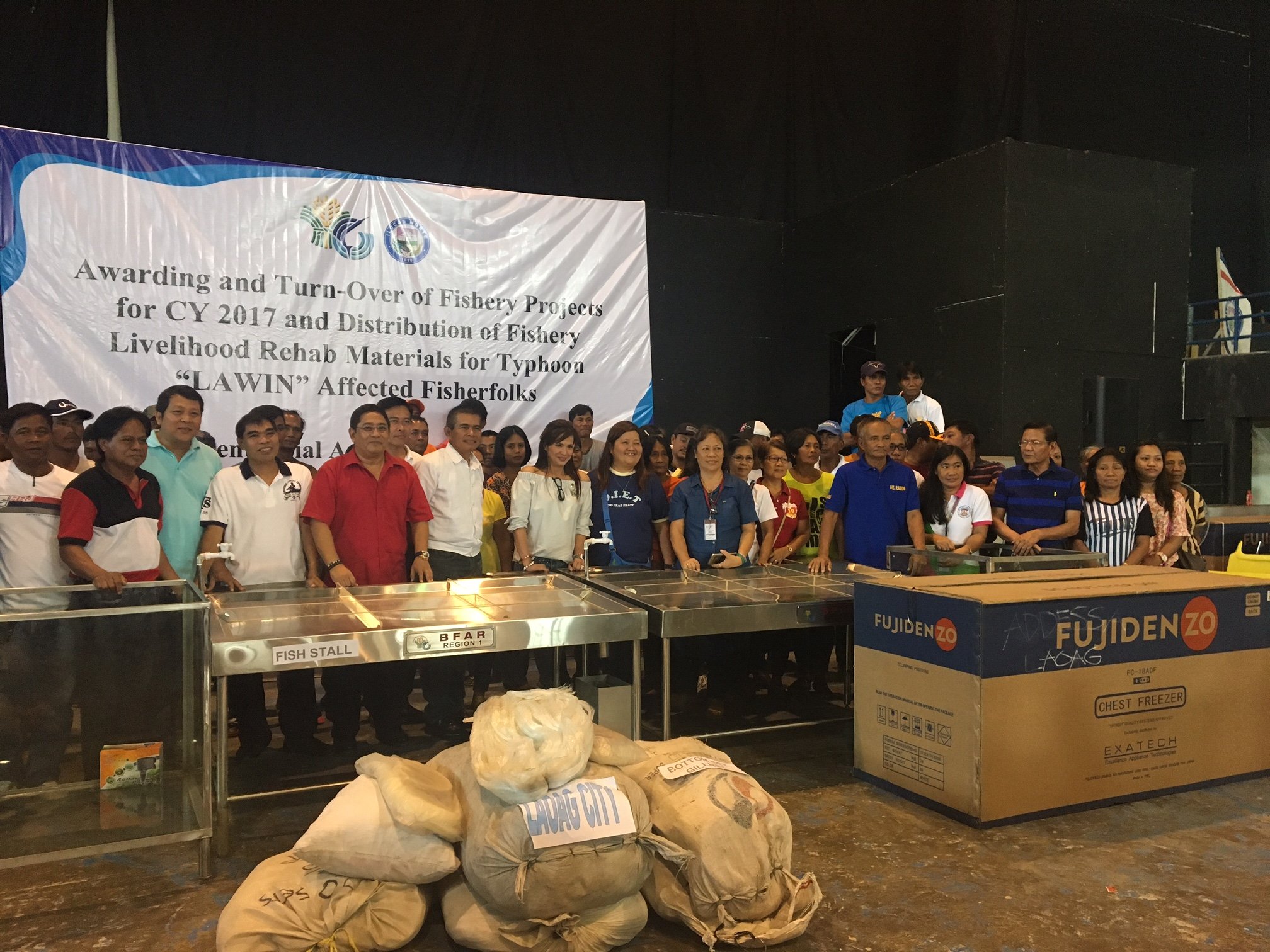 Distribution of various fishing materials to Ilocos Norte fishermen who were hard hit by typhoon Lawin