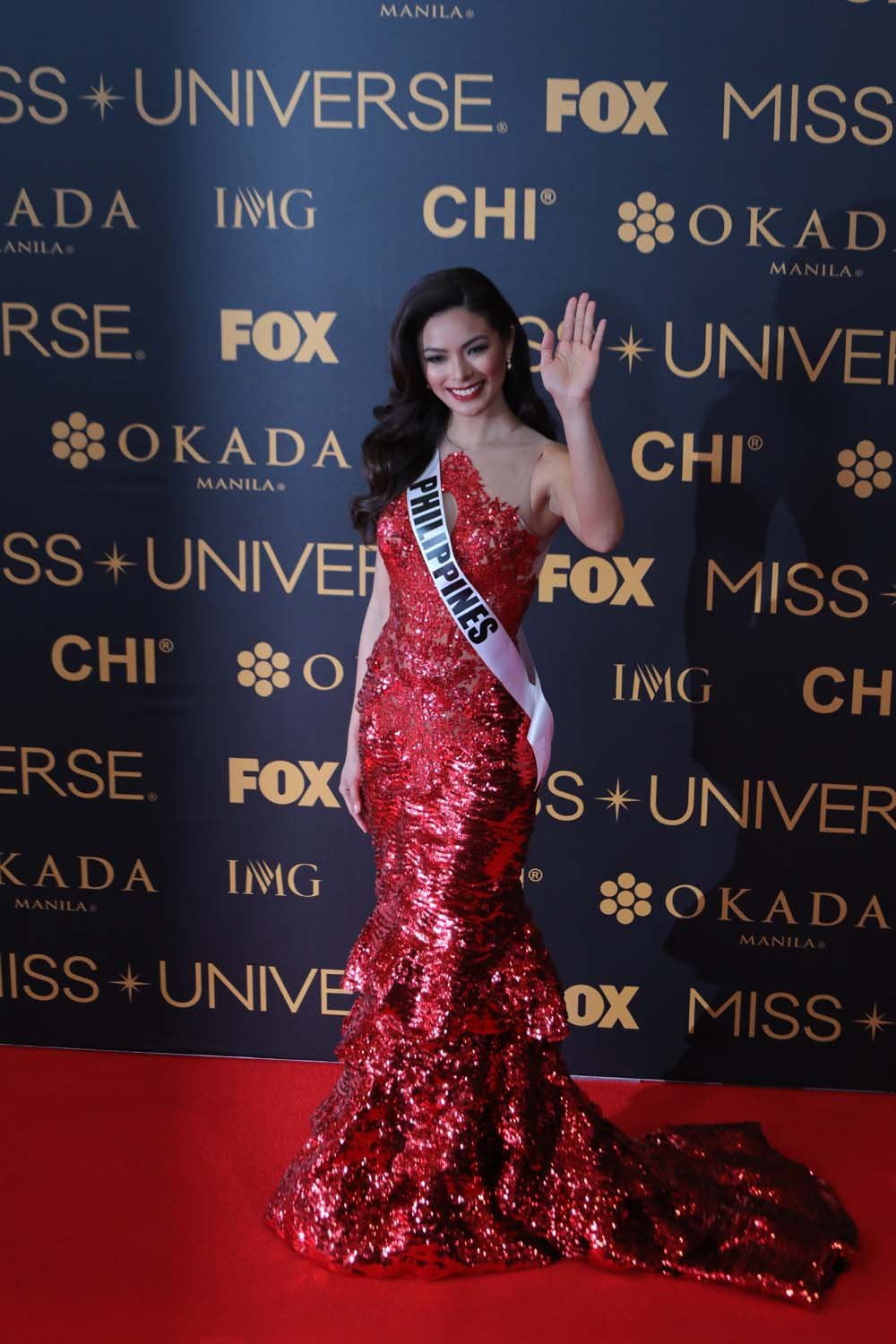 Miss Universe Philippines Maxine Medina waves to media at Red Carpet event