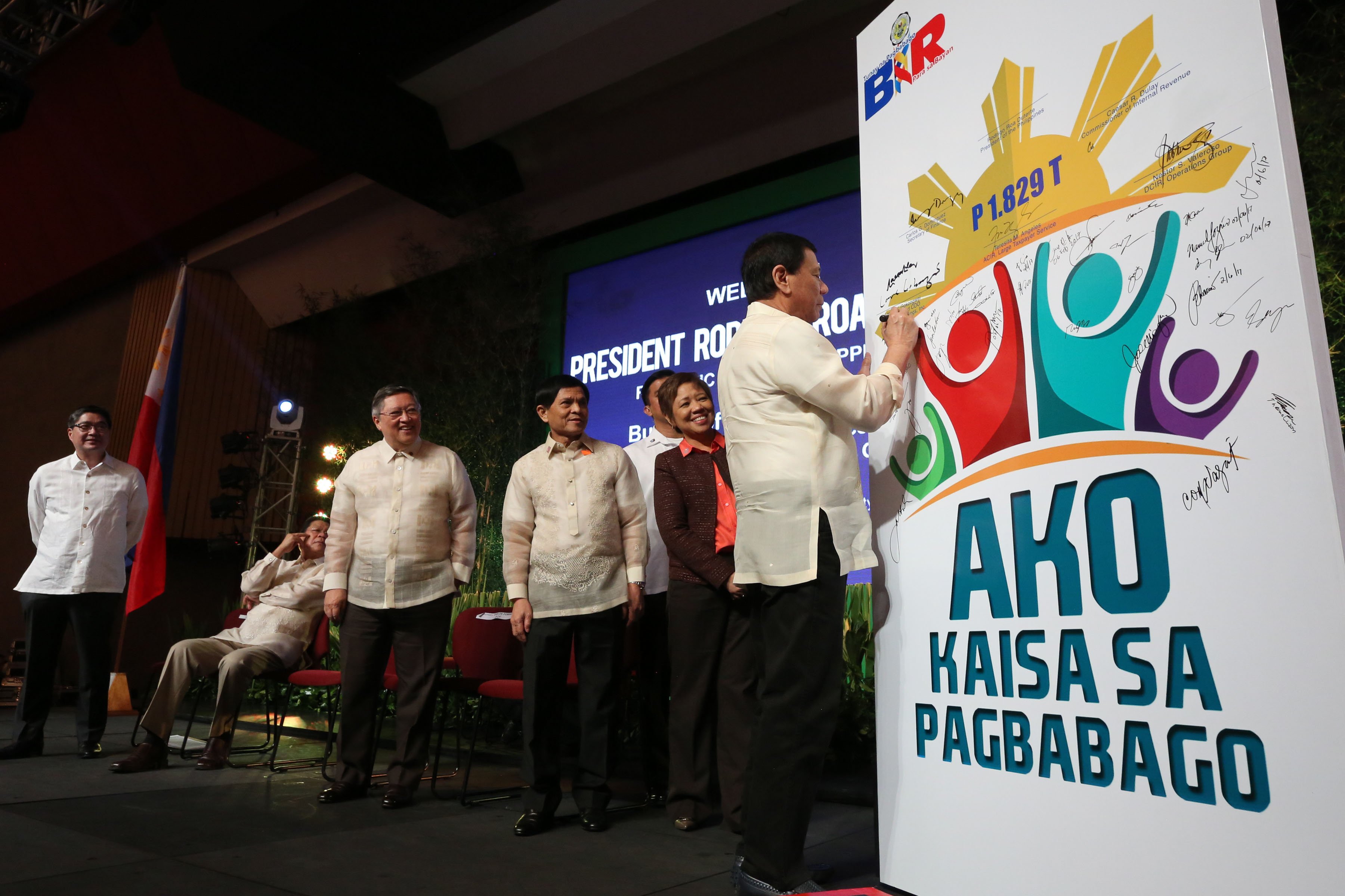 President Rodrigo Roa Duterte signs the commitment board