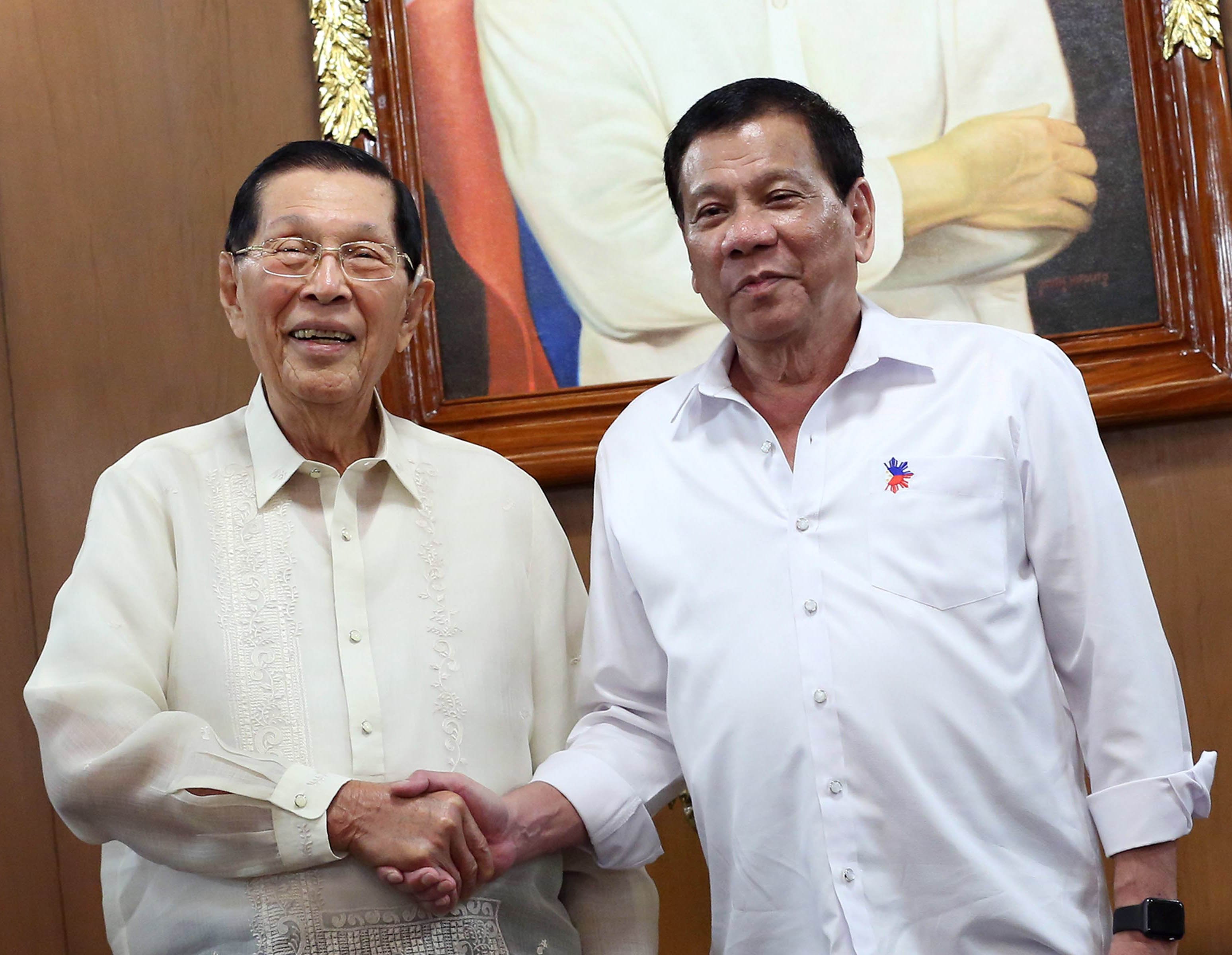 President Duterte shakes hands with Former Senator Juan Ponce Enrile