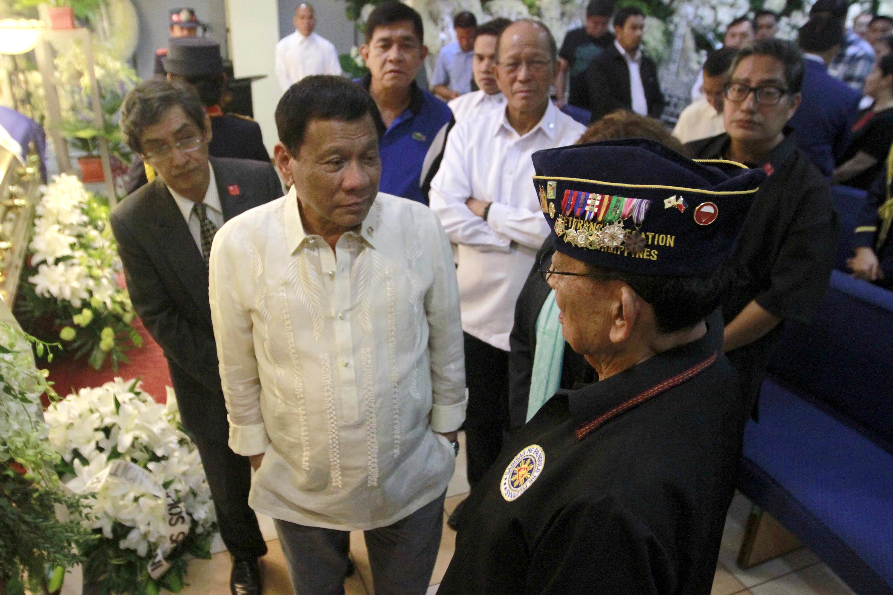 President Rodrigo Duterte chats with Former President Fidel Ramos during his visit to the wake of Former Senator Leticia Ramos-Shalani