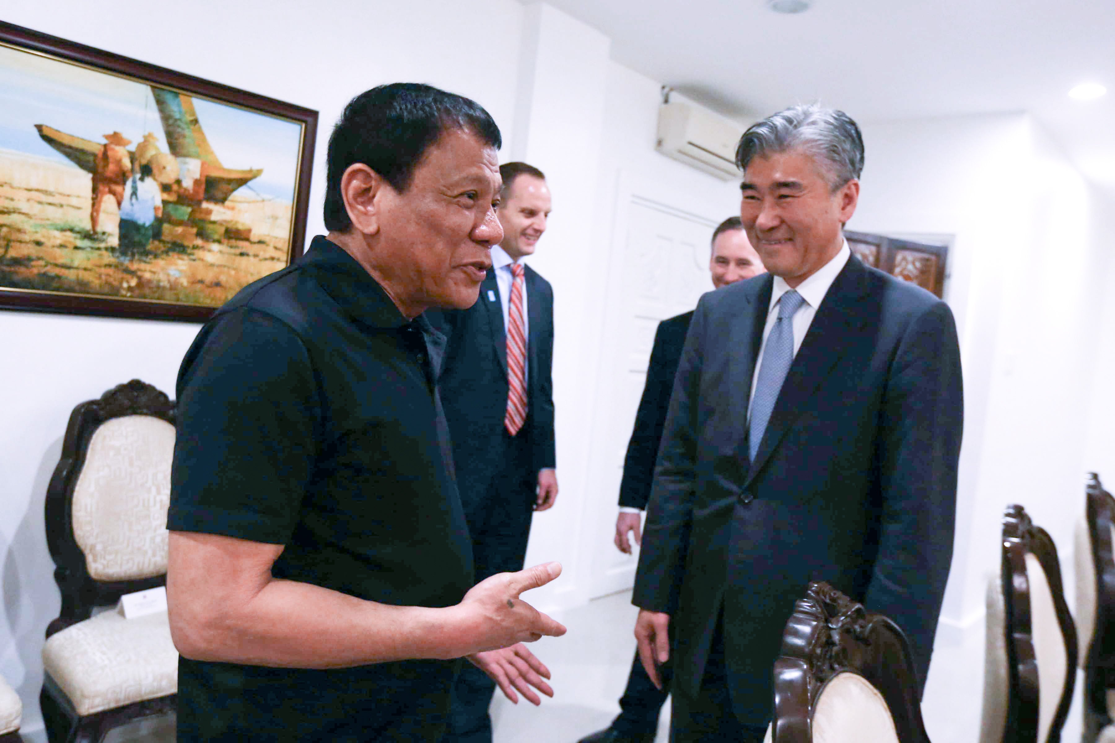 President Rodrigo Roa Duterte shares a light moment with US Ambassador to the Philippines Sung Kim