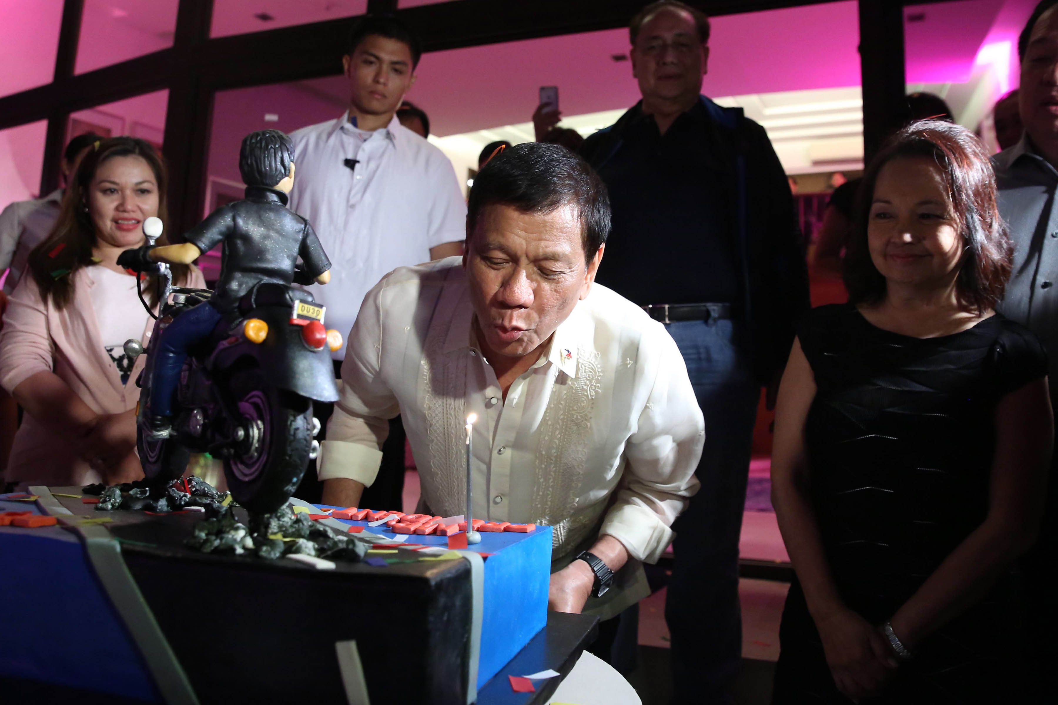 Pres. Duterte blows the candle of the birthday cake given by Former President and Incumbent Pampanga Second District Representative Gloria Arroyo