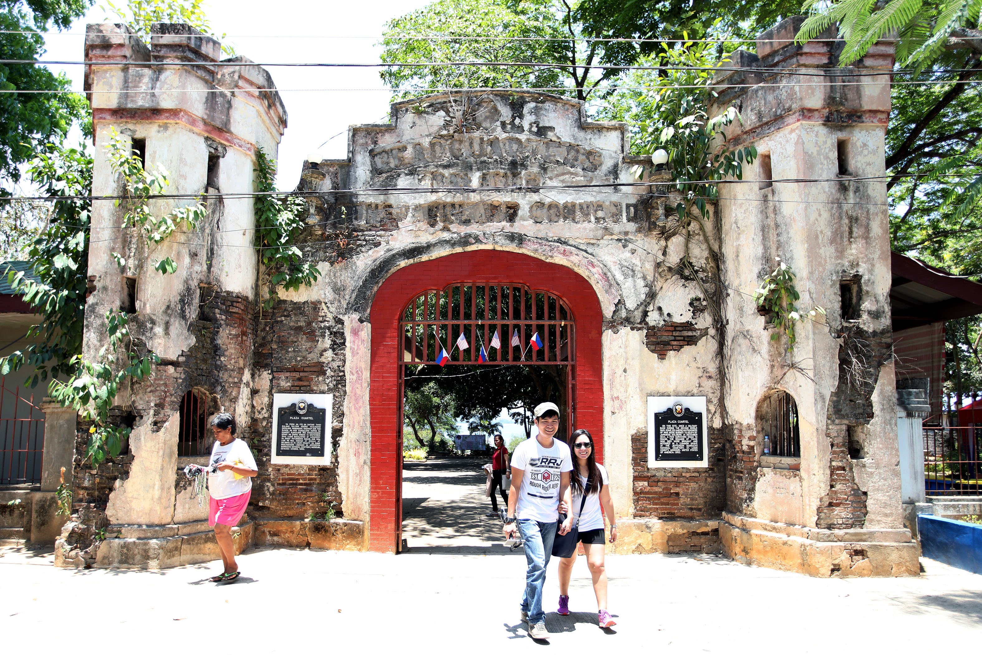 Tourists visiting the historic Plaza Cuartel in Puerto Princesa