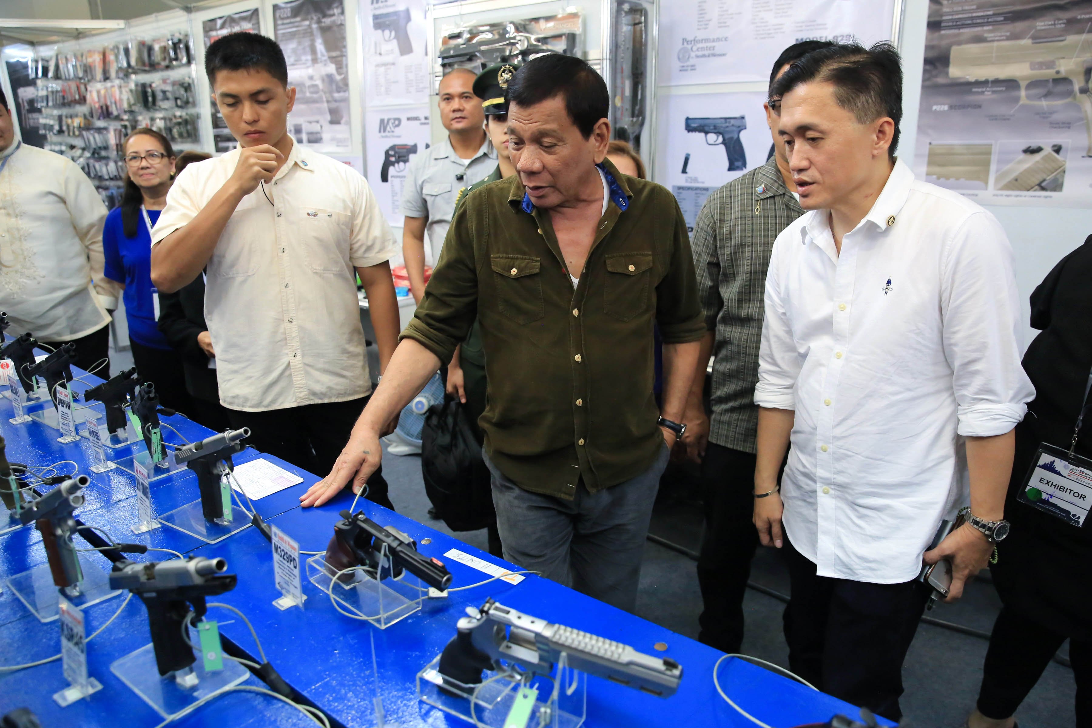 FIREARMS ON DISPLAY. President Duterte visits the AFAD arms show in Davao City