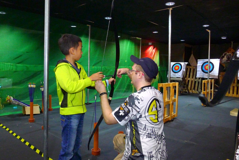 TACS kid learning archery