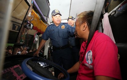 <p><strong>DELA ROSA AT ARANETA TERMINAL</strong>. Philippine National Police (PNP)  Director General Ronald Dela Rosa talks with a bus driver at the Araneta Center Bus Terminal in Quezon City on Friday (March 23, 2018). Dela Rosa reminded drivers and passengers to be cautious while traveling. He also visited the Quezon City Police District (QCPD) for a surprise inspection during the accounting of personnel in Camp Caringal. <em>(Photo courtersy of PNP-PIO)</em></p>