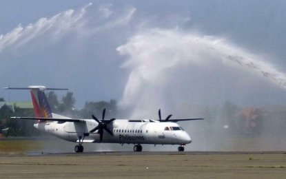 <p>A watercanon salute welcomes PR2379 as it touches down at Davao International Airport from Siargao on Sunday. <strong><em>PAL Corporate Communication</em></strong></p>