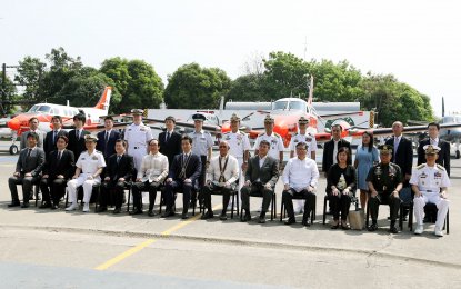 <p>Defense Secretary Delfin Lorenzana (6th from right), Japanese Ambassador to the Philippines Koji Haneda (5th from left) along with key officials of the Armed Forces of the Philippines and Japan's Ministry of Defense lead the turn-over of three TC-90 patrol aircraft to the Philippine Navy in Sangley Point, Cavite on Monday (March 26, 2018). <em>(PNA photo by Joey O. Razon)</em></p>