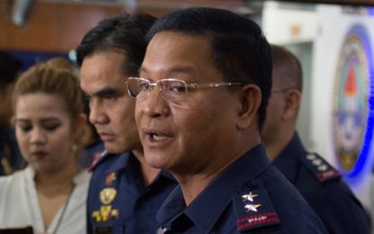 <p><strong>NOT BACKING DOWN. </strong>CIDG Director Chief Supt. Roel Obusan answers questions from the media regarding their appeal on the Department of Justice's dismissal of the drug charges against Kerwin Espinosa and Peter Lim in Camp Crame, Quezon City on Wednesday (March 14, 2018). </p>