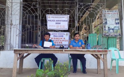 <p><strong>PEACEFUL</strong>. PO2 Rennie Boy Zayre Calunsag (left) and PO1 Janice Campaner de Guzman man a Police Assistance Desk and Women's Assistance Desk at the Our Lady of Fatima Parish Church in Barangay Poblacion, Sominot, Zamboanga del Sur on Maundy Thursday (March 29, 2018). The observance of the Holy Week in the Zamboanga region has been generally peaceful, according to the police. <em>(Photo from Sominot PCR facebook)</em></p>
