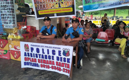 <p>Elements of the local police man an assistance desk set up at the Pagadian City Integrated Bus Terminal as security has been tightened to ensure peaceful and solemn observance of the Holy Week.<em><strong> (Photo by Hirohito D. Cadion)</strong></em></p>