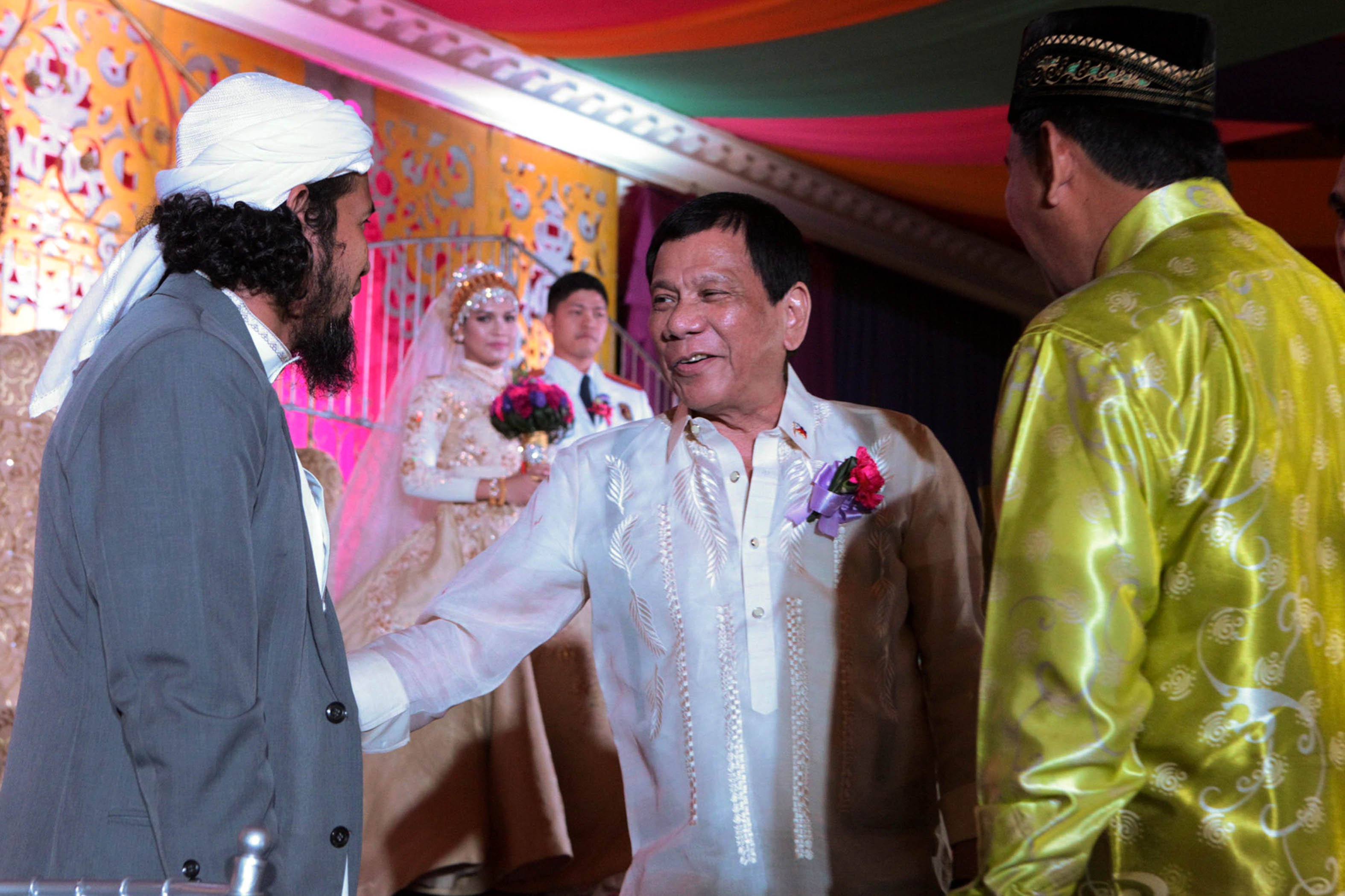 Pres. Duterte greets the Imams who presided over the wedding of Kinang-Hosmillo nuptials in Zamboanga City